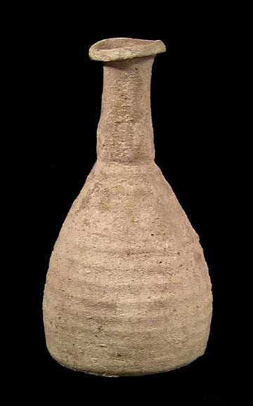HERODIAN TALL NECKED BOTTLE: HOLY LAND TALL-NECKED BOTTLE. Herodian Period, 37 BC-70 AD. The graceful terra cotta vessel with high neck and ridged body. 5.75 inches. Excellent intact example. The type used during the lifetime of 