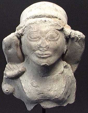 SIZABLE LA TOLITA NOBLE: LARGER LA TOLITA POTTERY BUST. Ecuador, ca. 300 BC. The bust of a high status nobleman wearing a large headdress over typical ritually deformed skull. 5 inches. On custom stand. Provenance: An extensi