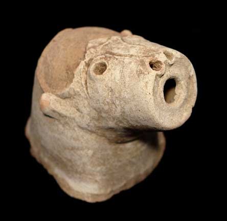 EARLY PERSIAN ANIMAL HEAD SPOUT: EARLY PERSIAN ANIMAL HEAD SPOUT, c. 7th-12th century AD. The details incised, abrasion to top of head. 3.5 inches. Free standing. Provenance: An extensive 20th century New Jersey collection assembled 