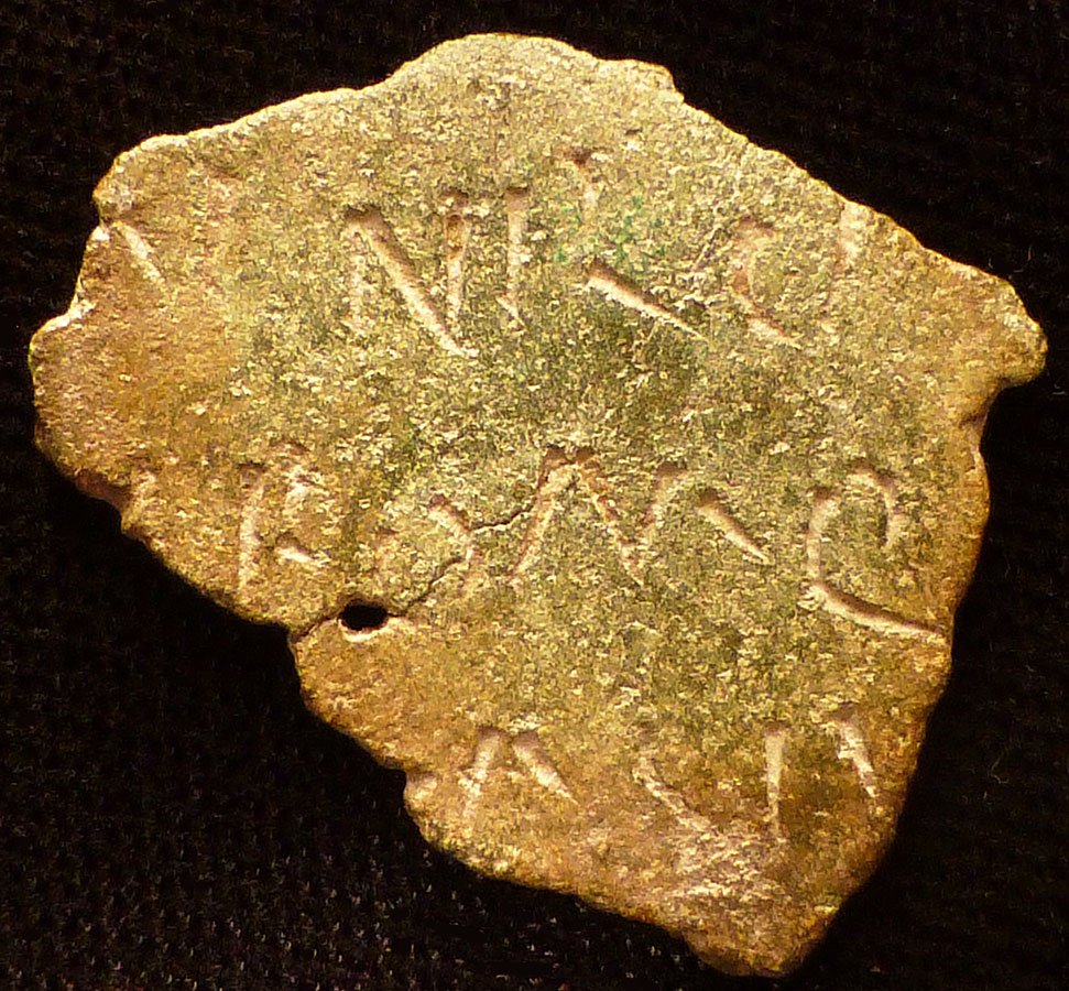 ROMAN LEGION DIPLOMA: ROMAN LEGIONARY MILITARY DIPLOMA FRAGMENT. Roman Province of Pannonia, c. 3rd-4th century AD. The small bronze fragment clearly inscribed in Latin on both sides. 20 x 25 mm. Rare. Excellent smooth for