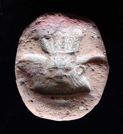 EGYPTIAN BES MOLD: EGYPTIAN TERRA COTTA AMULET MOLD OF BES. Late Period, first millennium BC. The mold used for the production of a faience amulet with good detail. 1.6 inches. Rare! Photographed with light from below f