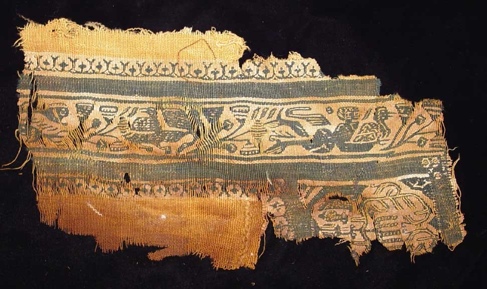 SWIMMING IN THE NILE: COPTIC TEXTILE. Egypt, Christian Period, c. 4th-6th century AD. Double-weave fabric with birds, flowers and a swimming Nubian catching a water bird. 5 x 10.5 inches. Provenance: The collection of a pr