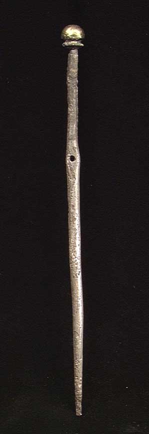 VERY RARE SILVER CLOAK PIN: RARE SYRIAN SILVER CLOAK PIN WITH GILDING. ca. 2nd millennium BC. The cloak pin of solid silver with central attachment hole and knobbed head, the head with much remains of gilding. 5.25 inches. These