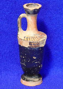 ATTIC BLACK GLAZE LEKYTHOS: ATTIC BLACK GLAZE LEKYTHOS, c. 6th-4th century BC. Dot and line pattern on shoulder and Greek key band. 5 inches.Provenance: An extensive 20th century New Jersey collection assembled over the past 35