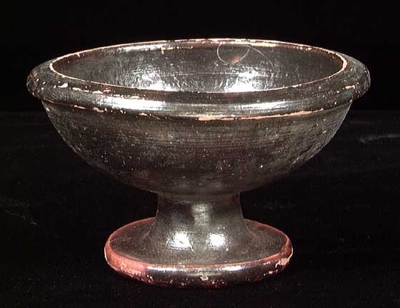 PRETTY GREEK BLACK-GLAZED BOWL: PRETTY GREEK BLACK-GLAZED BOWL, ca. 4th century BC. Nicely turned with pedestal base. 2 x 3.5 inches. Intact. Provenance: An extensive 20th century New Jersey collection assembled over the past 35 yea