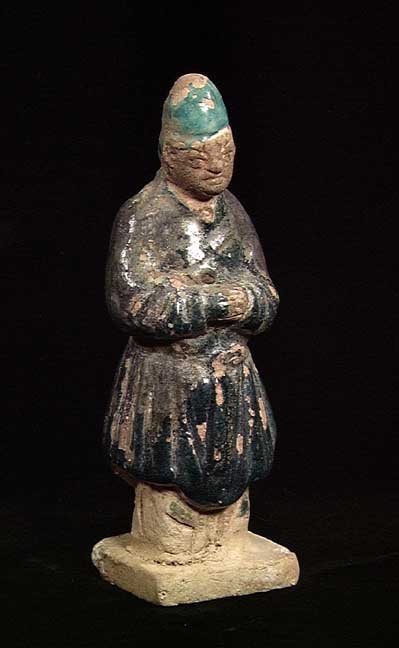 PUBLISHED IN 'ORIENTAL ANTIQUES AND ART': MING DYNASTY TOMB ATTENDANT, 1368-1644. The robed male figure with scarce dark and light blue glaze. 6.5 inches. Provenance: Purchased by the current owner from a large Mid Western collection in the 1