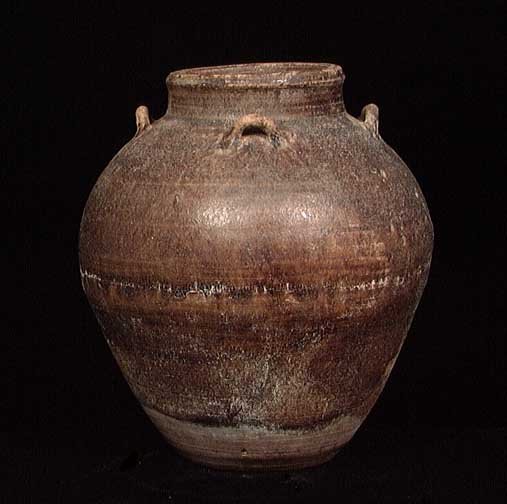 SUBSTANTIAL MING DYNASTY VESSEL: SUBSTANTIAL MING DYNASTY VESSEL, 1368-1644. The heavy brown glazed vessel with four small looped handles. 7.5 x 9". Intact. Provenance: The collection of a Midwestern business executive. Acquired from