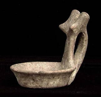 VERY RARE EARLY VILLANOVAN KYATHOS: VERY RARE EARLY VILLANOVAN GRAY WARE KYATHOS, ca. 8th-6th century BC. The small bowl with high double handle ornamented with two knobs and twin breast-like protrusions. 3.25 x 3.75. A very rare early