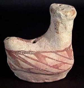 VERY RARE EARLY ITALIC POLYCHROME ASKOS: VERY RARE EARLY ITALIC POLYCHROME ASKOS, c. 8th-7th century BC. The vessel in the form of a water fowl with red polychrome detailing. 5 inches. Intact and very rare early piece.Provenance: An