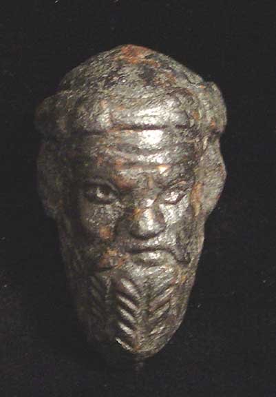 ARTISTIC ROMAN BRONZE HEAD OF SILENUS: FINE ROMAN BRONZE HEAD OF SILENOS, c. 1st-2nd century AD. The satyr with long beard and mustache and goat ears, a vine wreath on his bald head. 36 mm. Fine classical style. Provenance: Acquired at Daw
