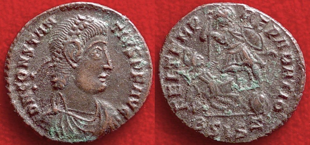 ROMAN COIN OF CONSTANTIUS II EMPEROR: CONSTANTIUS II, 337-361 AD. AE18. Obverse: Diademed, draped, and cuirassed bust right. Reverse: soldier spearing barbarian cavalryman. Good VF. Ex. Collection JA.