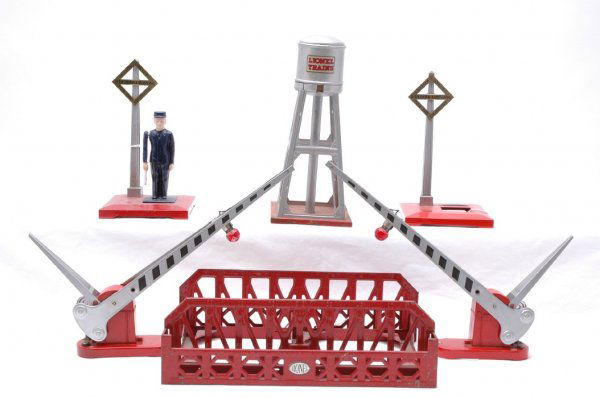 Lionel 270 two 152 93 and two 1045: Lionel prewar accessories; 270 single span bridge, two 152 crossing gates, 93 water tower, and two 1045 operating watchman. 93 is missing spout. One 1045 is missing man. C5-6.