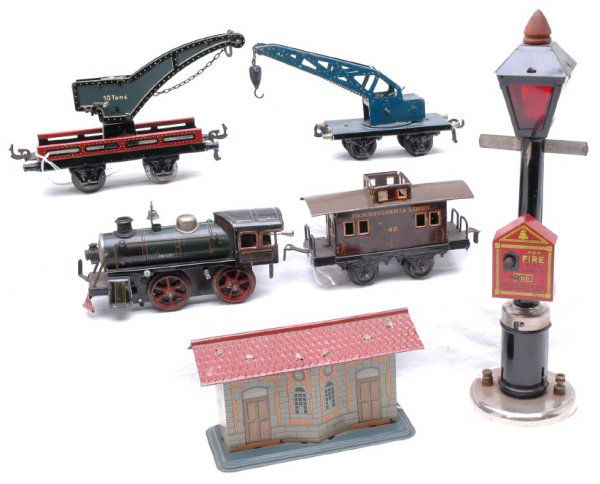 KBN 0-35 Loco Bing 40 Cab Marklin Crane 666 Lamp: KBN 0-35 loco, Bing 40 caboose missing cupola, Marklin blue crane car, German crane car , 666 The Gong Mfg Co. lamp post, and KBN station, C5.