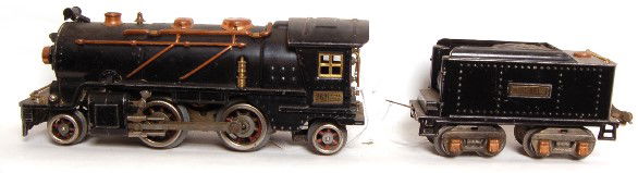 Lionel 262 2-4-2 262T Lionel Lines: Lionel 262 2-4-2 steam engine with 262T Lionel Lines tender. Items in this lot are sold as shown in the photo as a box lot with no returns.
