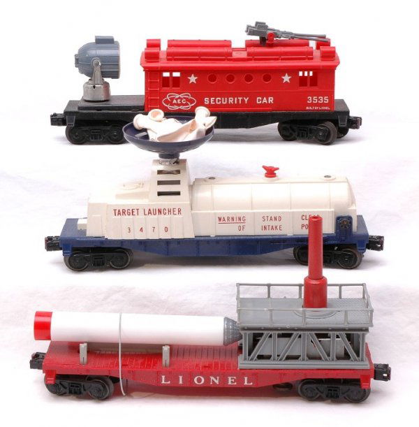 Lionel 3413 Mercury 3470 Target and 3535 Security: Lionel postwar 3413 Mercury capsule with repro rocket and broken railings, 3470 target launcher with repro ballons, and 3535 security car with repro machine gun, all are C6.