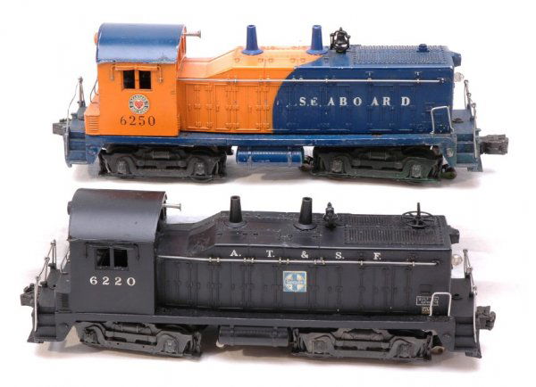 Lionel 6220 and 6250 NW2 Switchers: Lionel postwar 6220 NW-2 Santa Fe switcher with melt marks on cab, C6; 6250 NW-2 Seaboard switcher with some green paint on side of frame, roller brackets and truck sides, C5.