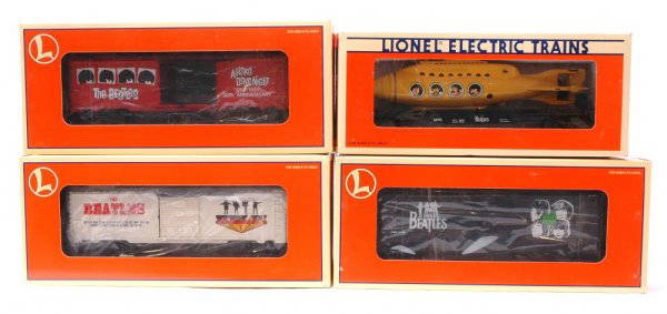 Lionel Beatles Freight Cars MINT Boxed: Lionel Beatles flatcar with a Yellow Submarine, boxcar, The Beatles A Hard Days Night 35th anniversary boxcar, and The Beatles Help! boxcar in OBs, C10.
