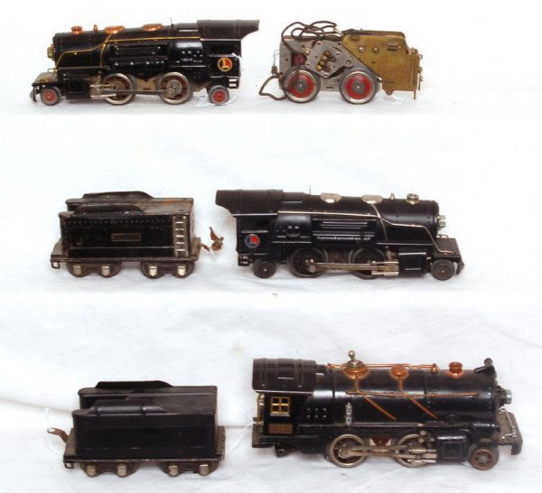 Lionel 259, 259E, 261, two tenders one motor: Lionel 259, 259E, 261, two tenders and one motor. Items in this lot are sold as is shown in photos with no returns.