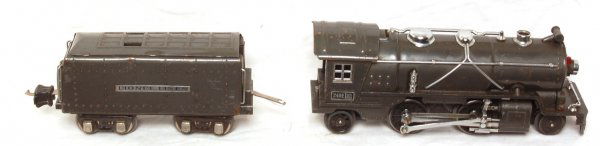 Lionel 249E 2-4-2 loco and 265W tender Gun-metal: Lionel 249E 2-4-2 loco and 265W tender, Gun-metal. Loco and tender were tested on a short test track. Loco operates smoothly in forward and reverse and tender sounds good.
