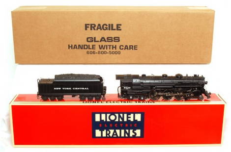 Lionel 18005 NYC 1-700E 4-6-4 Hudson in OB: Lionel 18005 New York Central 1-700E 4-6-4 Hudson with display case in original boxes. Loco looks perfect, but is graded C8 due to having been run. Train box shows light wear. Display is factory