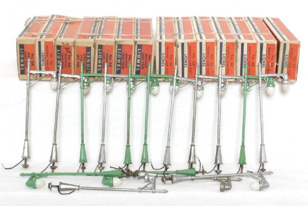 Sixteen Lionel No. 64 Highway Lamp Posts 14 OBs: Sixteen Lionel No. 64 Highway Lamp Posts with fourteen original boxes. All lamps are missing their bases and have had a nut and bolt added for mounting to a layout. Boxes have celophane tape on them.