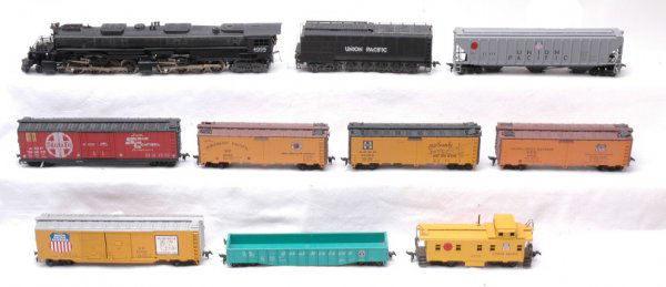 Rivarossi UP 4-8-8-4 Big Boy and 8 Freight Cars: Rivarossi HO Scale Union Pacific 4-8-8-4 Big Boy with eight freight cars with some rust on base and axles. Loco has some trim missing below the bottom corner of cab. Loco, tender, and car bodies are C