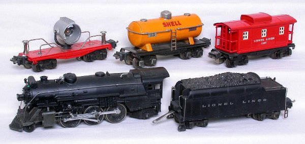 Lionel prewar O 225E 2235W 2620 2654 267 set: Lionel prewar O 225E loco, 2235W tender, 2620 searchlight car, 2654 tank car, and 2657 caboose, all original C5 though tender and searchlight wiring is brittle.