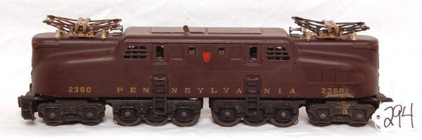Lionel 2360 tuscan Pennsylvania GG1: Lionel 2360 tuscan Pennsylvania 5 stripe GG1, original paint, light surface rust on pantographs, however has a battery damage spot on the shell and frame that is shown in the photos. This item is sold