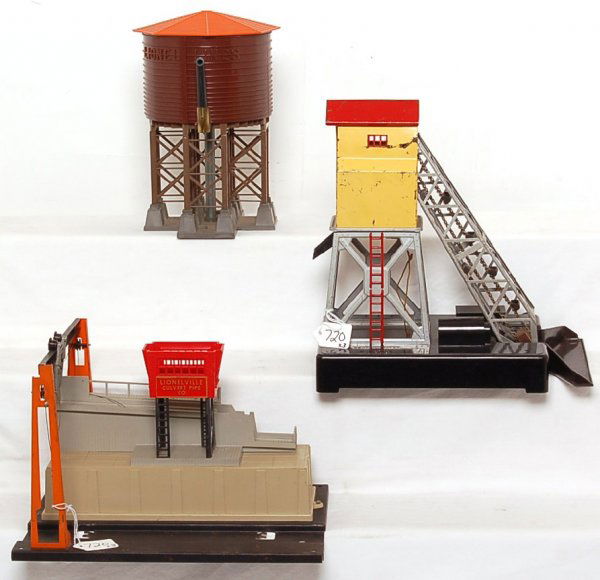 Lionel No. 138, 97, 345: Lionel No. 138 water tower, 97 coal elevator, 345 culvert unloader. Items in this lot are sold as are shown in our photos with no returns.