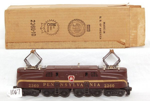 Lionel 2360 Pennsylvania GG1 in OB: Lionel 2360 Pennsylvania GG1, painted stripe with heat stamp lettering variation, very slight warp to cab, C7+. Mead 2360-10 OB C8 with insert and inst. sheet.