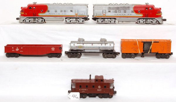 Lionel 2343 Santa Fe, 6462, 3464, 6465, 6457: Lionel 2343 Santa Fe F-3 diesel A units, 6462, 3464, 6465, 6457. Powered 2343 has a cracked shell and 6457 has a cracked shell. Items in this lot are sold as they are shown in our photos with no retur