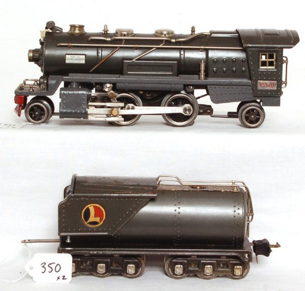 Lionel No. 260E 2-4-2 loco and 263W tender: Lionel No. 260E 2-4-2 loco and 263W tender, gunmetal gray. Loco has a repainted boiler front and a replaced frame and steam chests. Boiler and cab are original paint. Loco was tested on a short sectio