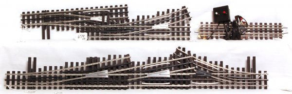 Five Ross three rail O gauge switches: Five Ross three rail O gauge switches of different lengths and radius. Four have aluminum frogs, the other is plastic. One uncoupling section that is unmarked is included. Please view our photographs