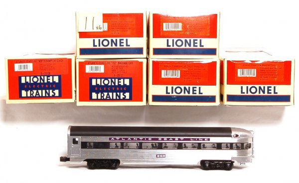 Six Lionel Atlantic Coast Line passenger cars: Lionel 19155 ACL No. 101 combine car, 19156 ACL Talladega dining car, 19157 ACL Moultrie coach, 19158 ACL No. 256 observation car, 29127 ACL 152 baggage car and 29128 ACL North Hampton coach, aluminum