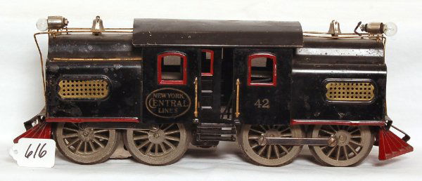 Lionel No. 42 0-4-4-0 round hood electric loco: Lionel No. 42 0-4-4-0 round hood electric loco, missing two handrails and has been rewired, otherwise C6+. Loco was tested and operated smoothly in both forward and reverse.