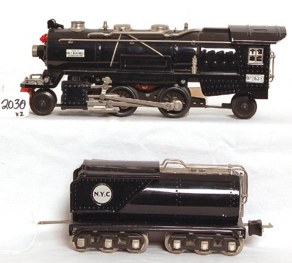 MTH Lionel 263E 2-4-2 loco and tender: MTH Lionel 263E 2-4-2 loco and tender, both have a light film of some sort of overspray, may clean C8. Loco was bench tested on a short section of test track operating smoothly in forward and reverse.