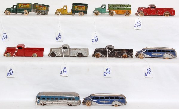Ten Tootsie Toys trucks and buses