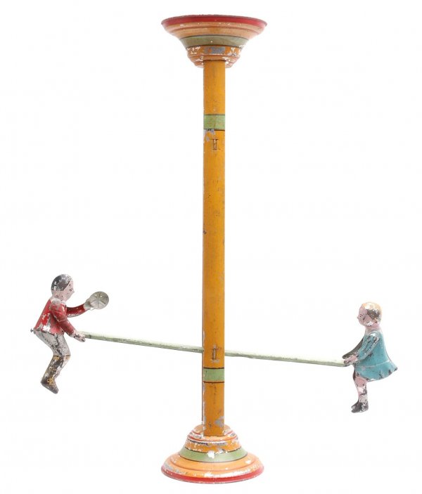 Gibbs 1910 Mechanical Seesaw Reversible Gravity: Gibbs 1910 mechanical seesaw reversible gravity toy, circa 1920. The seesaw is lithographed with two tin figures. The seesaw has paint flaking and is in good condition.