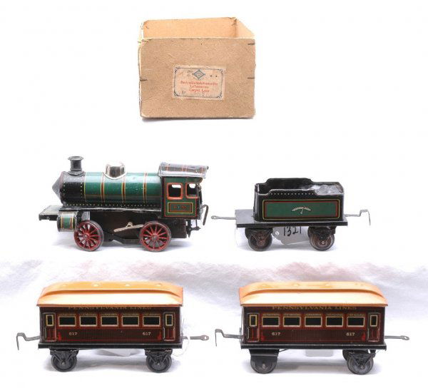 Bing O Ga Floor Train Set w Loco Tender Pa Cars: Bing prewar O gauge floor toy train set including; clockwork 0-4-0 loco and tender in OB with two Pennsylvania coaches numbered 617. The loco is missing cam and cowcatcher. The loco is C5. The tender