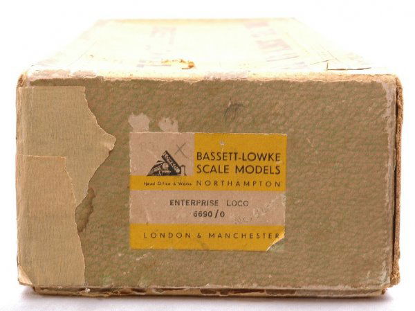 Bassett Lowke Original Box ONLY for 6690/0: Bassett Lowke original box only for 6690/0 Enterprise loco with original wrap. Both labels are intact. There is a hole in the top of the box. The box is stained with tape repair.