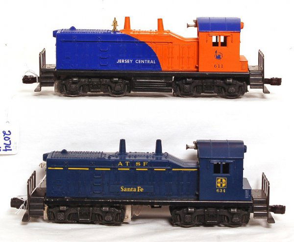 Lionel 611 Jersey Central, 634 Santa Fe NW-2: Lionel 611 Jersey Central and 634 Santa Fe NW-2 diesel switchers, 611 has chip and screw crack, 634 has small piece missing at screw, otherwise C7.