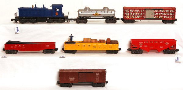 Lionel 621, 3562-50, 6342, 6454, 6476, 6434, 2465: Lionel 621 Jersey Central NW-2 switcher, 3562-50 AT&SF barrel car, 6342 NYC culvert gondola, 6454 NYC boxcar, 6476 Lehigh Valley hopper, 6434 poultry dispatch, 2465 Sunoco tank car. Loco has screw cra