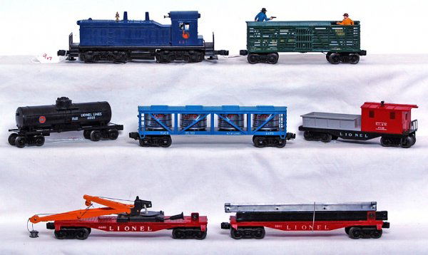 Lionel 621, 3370, 6802, 6475, 6025, 6660, 6119: Lionel 621 Jersey Central NW-2 diesel switcher, 3370 W&A outlaw car, 6802 flatcar with girders, 6475 Pineapple vat car, 6025 tank car, 6660 boom crane car, 6119 D.L.&W. work caboose, 621 has repaired