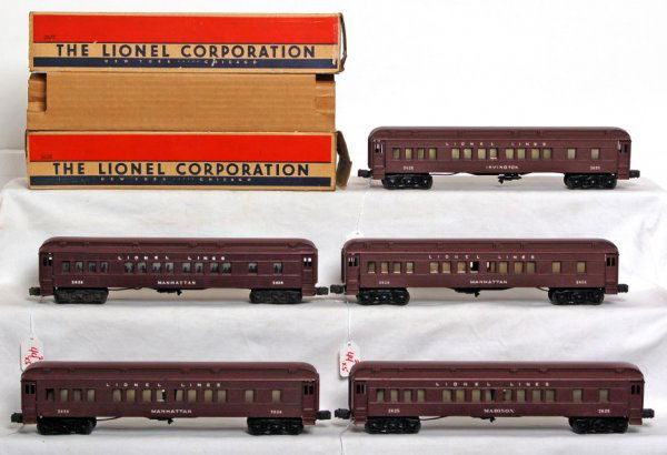 Five Lionel Madison passenger cars two OB, insert: Three Lionel 2628 Manhattan Pullmans, two 2625, one Madison and one Irvington Pullmans. One 2628 Manhattan car has been restored, with one step repaired and one crack in one side of shell. Others are