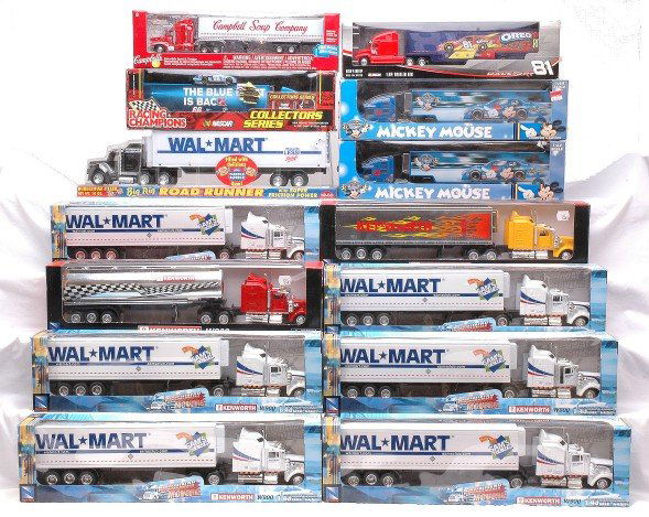Assortment of Tractor Trailer Trucks New in Boxes: Assortment of tractor trailer trucks factory new in original boxes including Walmart, Mickey Mouse, NASCAR, Campbell soup and Kenworth.
