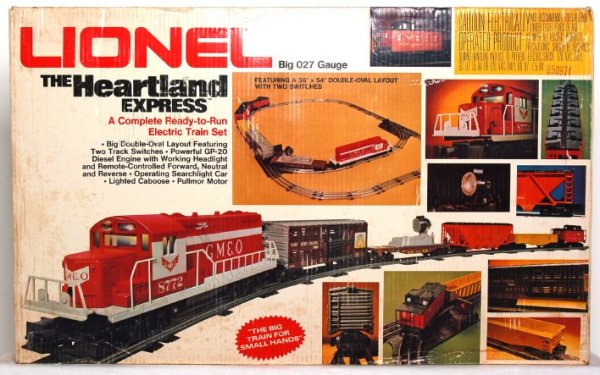 Lionel 1764 The Heartland Express set in OB: Lionel 1764 The Heartland Express set in original box with cello cut open. Set may or may not be complete. Set consists of: 8772 loco, 9116 hopper, 7808 stock car, 9283 gondola w/canisters, 9302 searc