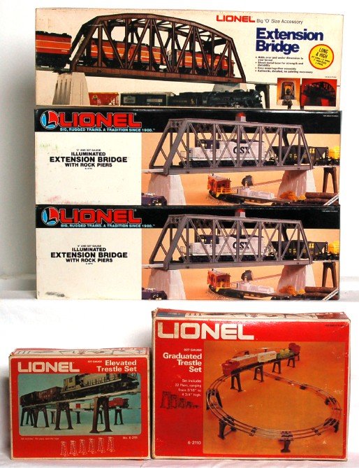 Lionel 2122, 12772, 12772, 2110, 2111 in OB: Lionel 2122 extension bridge, two 12772 extension bridge with rock piers, 2110 graduated trestle set and 2111 elevated trestle set, in original boxes, C8-9. Boxes show light to mild wear.