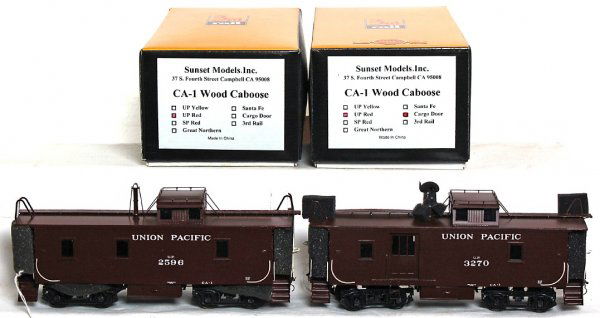 3rd Rail brass Union Pacific CA-1 wood cabooses: Sunset Models, 3rd Rail brass 2 rail O scale Union Pacific CA-1 wood cabooses in original boxes. Both are marked UP red, one has cargo door. Both look C9-10.
