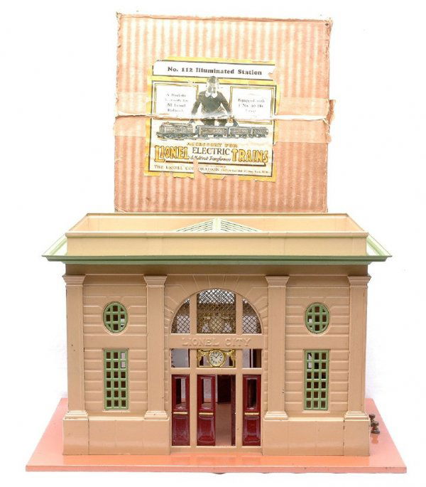 Lionel 112 Illuminated Station Beige Walls Boxed: Lionel prewar 112 illuminated station in OB. The station has terra cotta base, beige walls, apple green roof, window inserts and skylight, maroon doors and brass clock inserts, C7. OB is sealed on lab