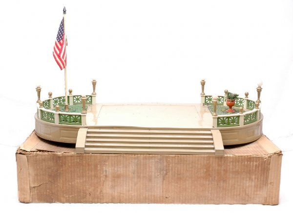 Lionel 129 Terrace Light Mojave Pea Green Boxed: Lionel prewar 129 terrace in OB with light mojave base, pea green fences, white railings and gold painted lamp posts. The flag pole has a brass pedestal and a black finial. The flower urn is terra cot